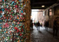 The Seattle Gum Wall with unrecognizable people.