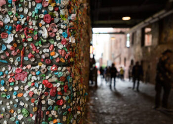 The Seattle Gum Wall with unrecognizable people.