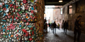 The Seattle Gum Wall with unrecognizable people.