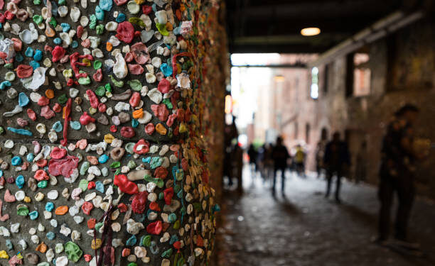 The Seattle Gum Wall with unrecognizable people.