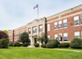 Exterior view of a typical American school building seen on a spring day