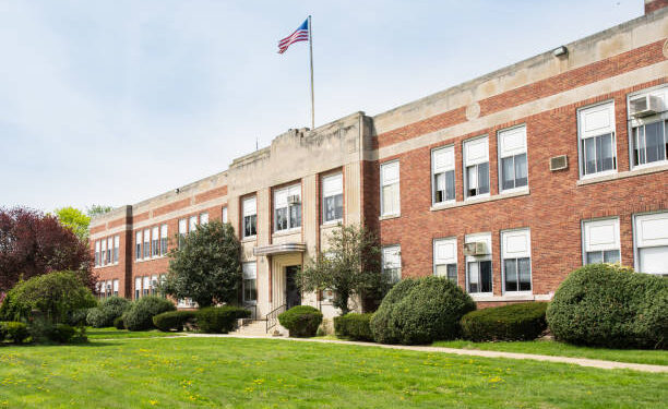 Exterior view of a typical American school building seen on a spring day