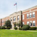 Exterior view of a typical American school building seen on a spring day