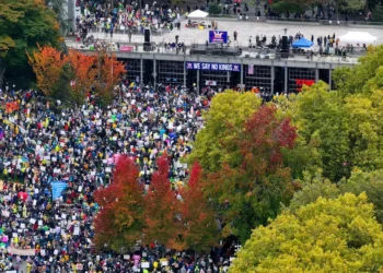 Thousands Gather for ‘No Kings’ Protest March Through Downtown Seattle
